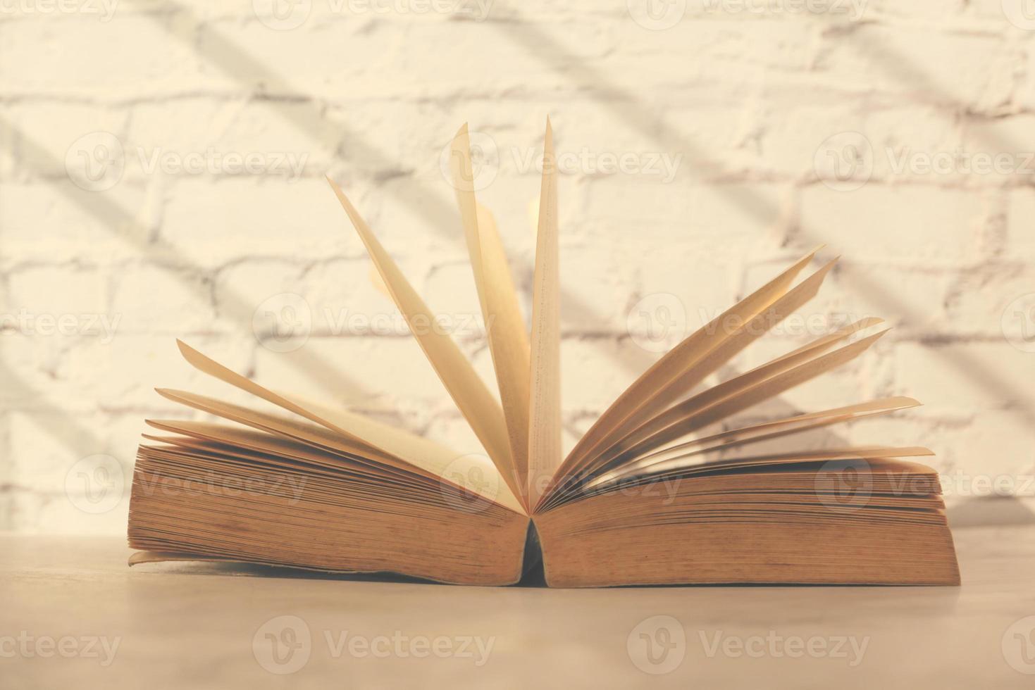 Close up of open book on a table photo