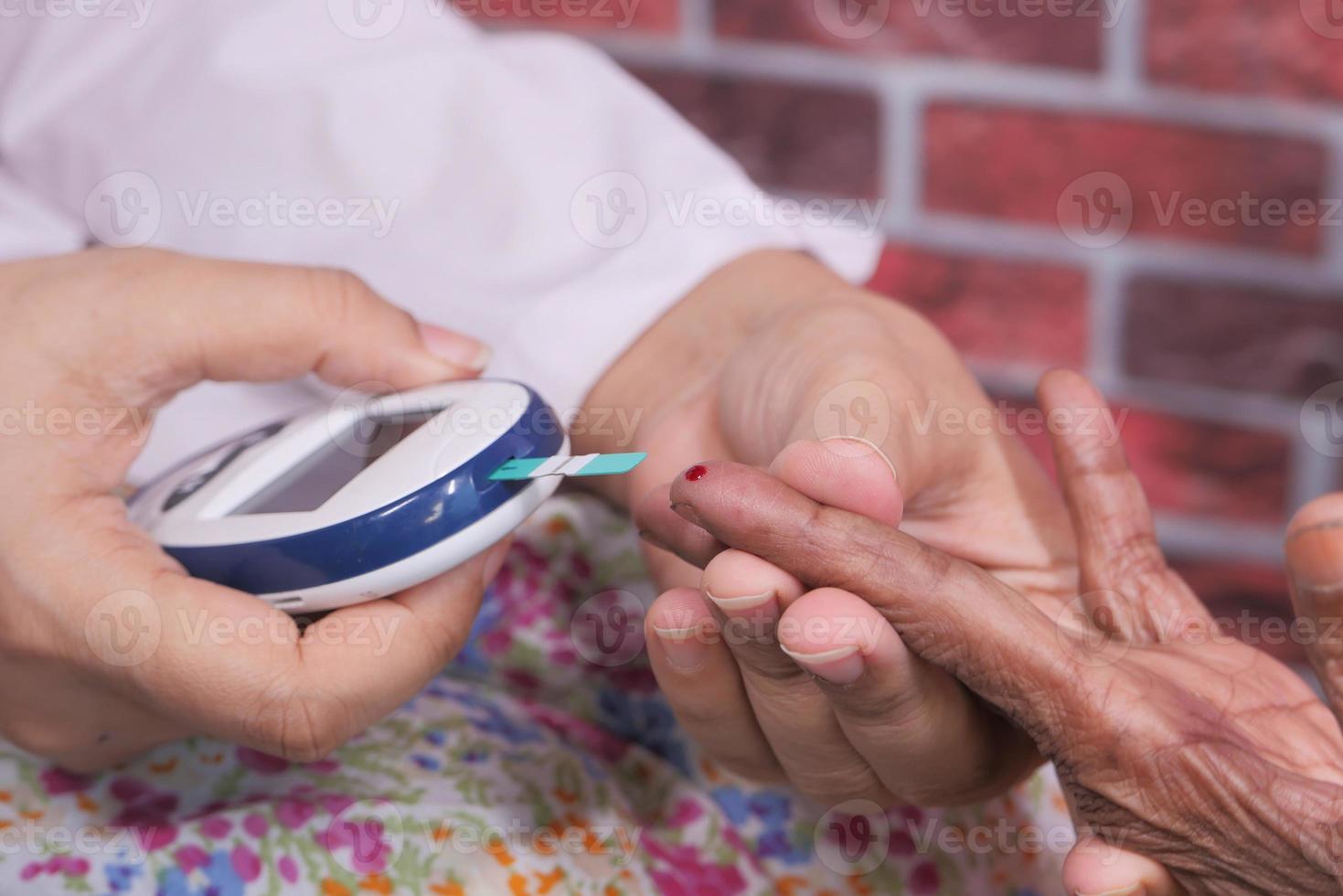 Blood test of diabetic woman photo