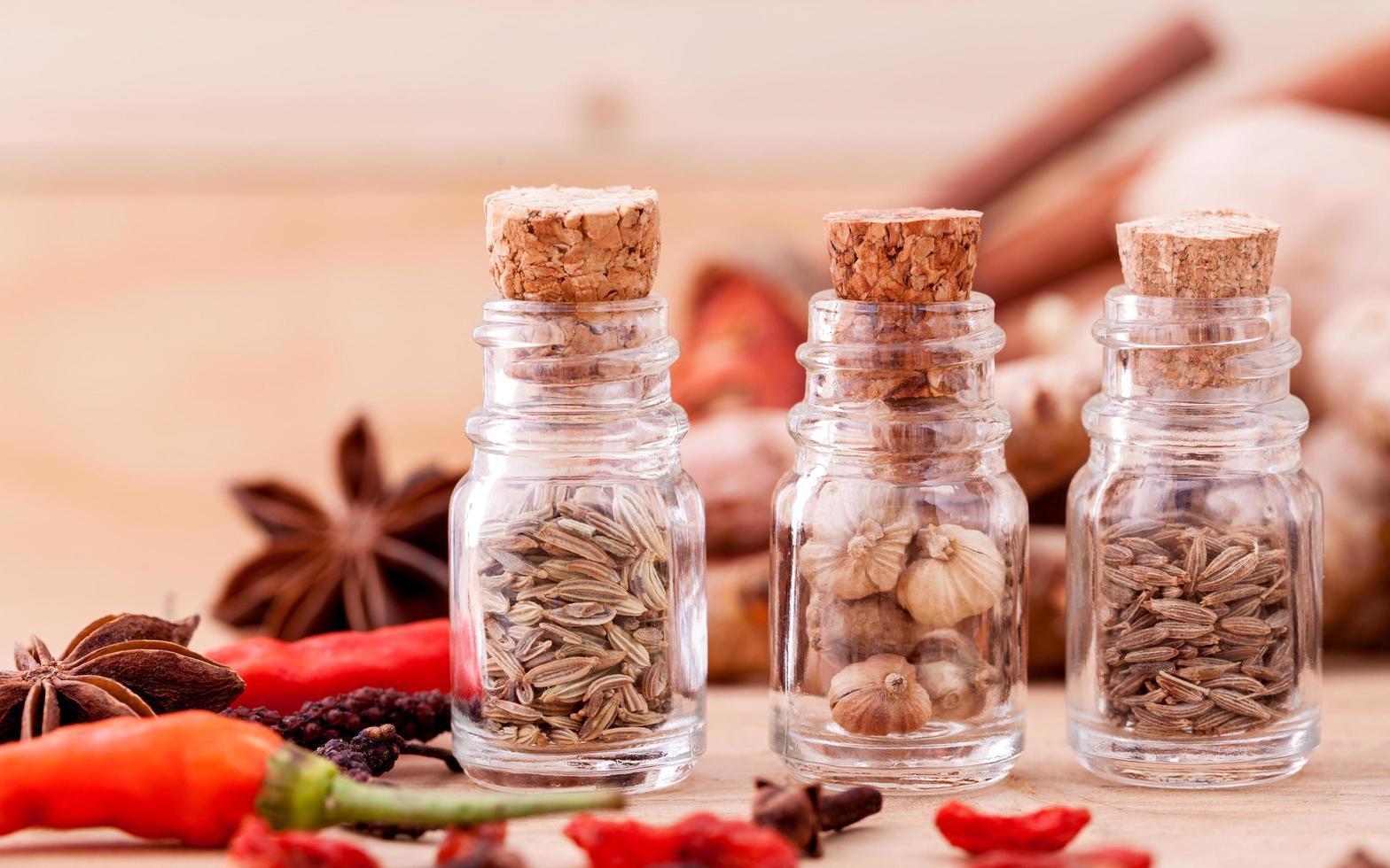 Glass bottles of spices photo