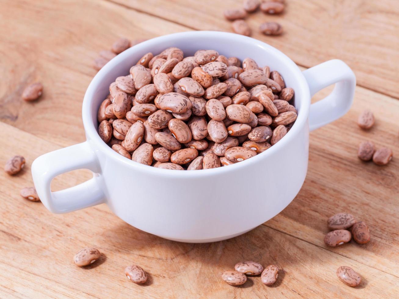 Brown pinto beans in a bowl photo