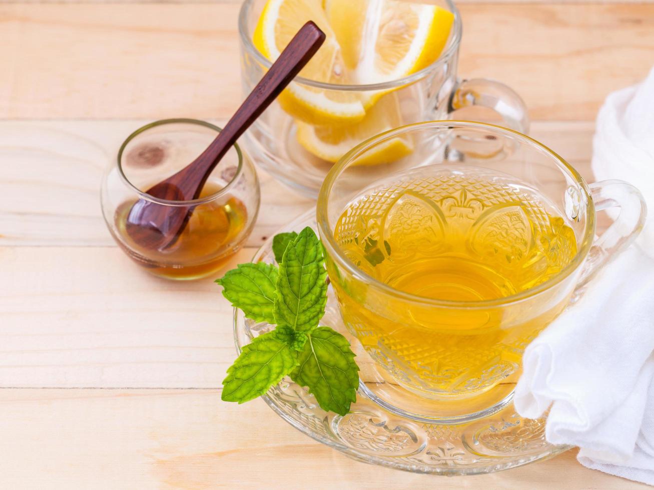 Herbal tea with mint, lemon, and honey photo