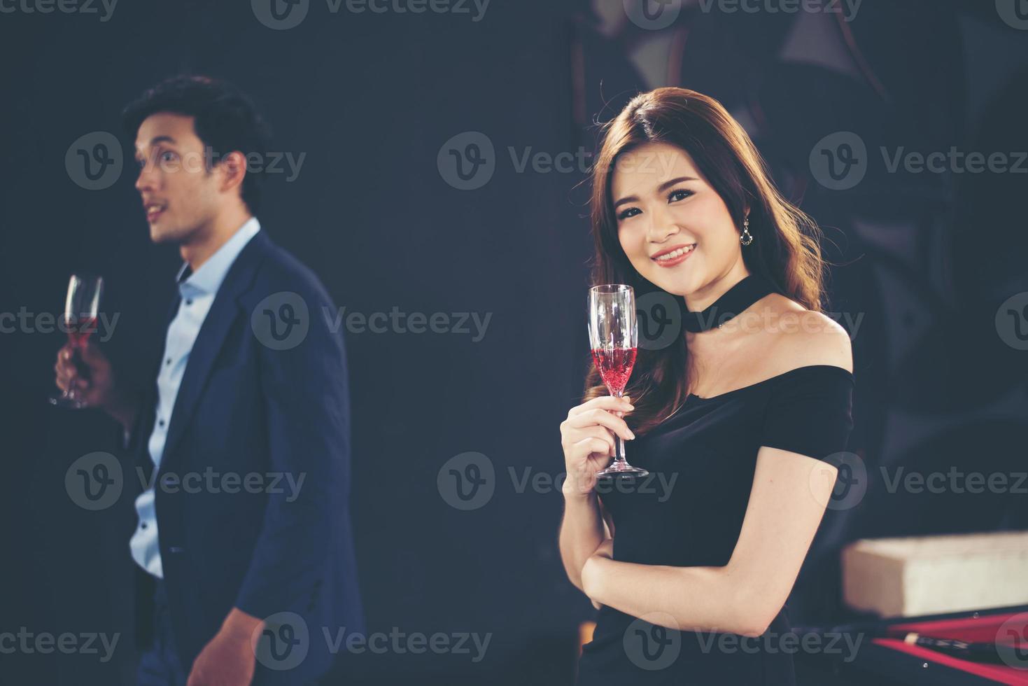 Young business couple with glasses of champagne. photo