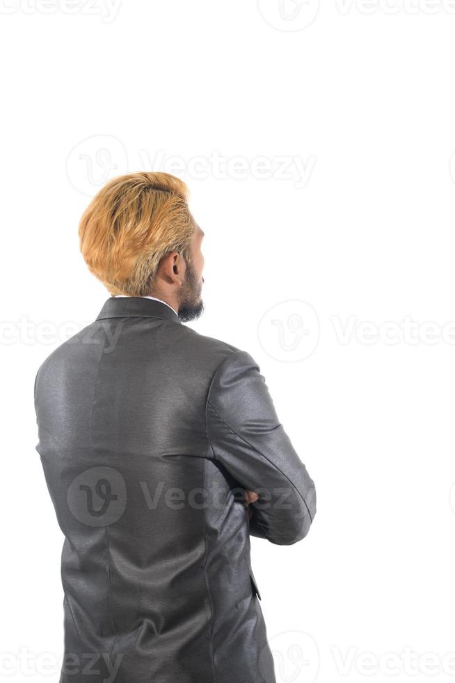 Confident young businessman in suit isolated on white background photo