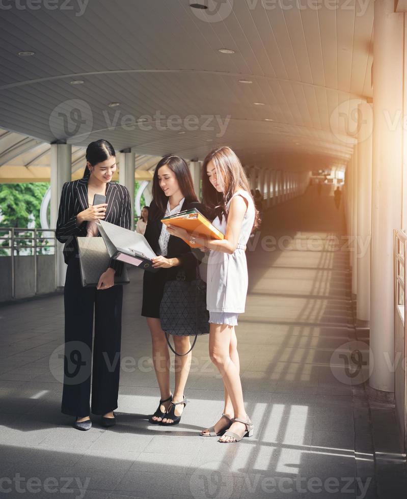 Businesswomen discussing work together photo