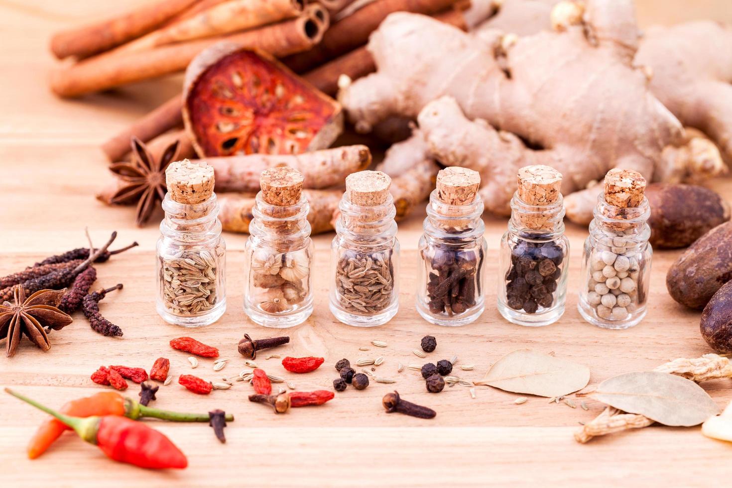 Spices in glass bottles photo