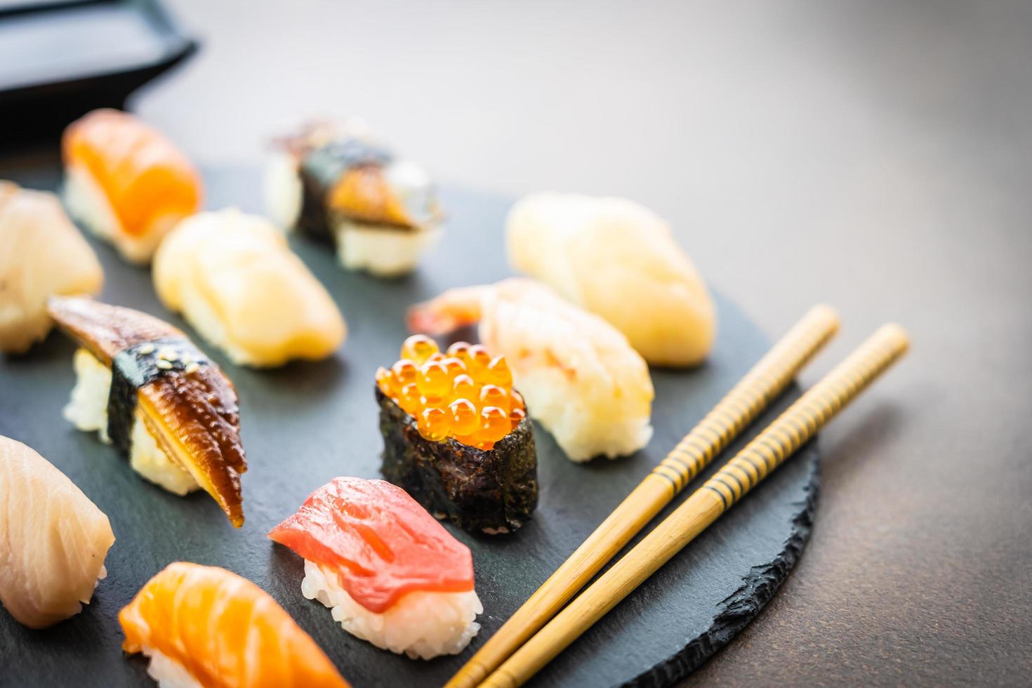 Nigiri sushi set with salmon, tuna, shrimp, prawn, eel, shell and other sashimi photo