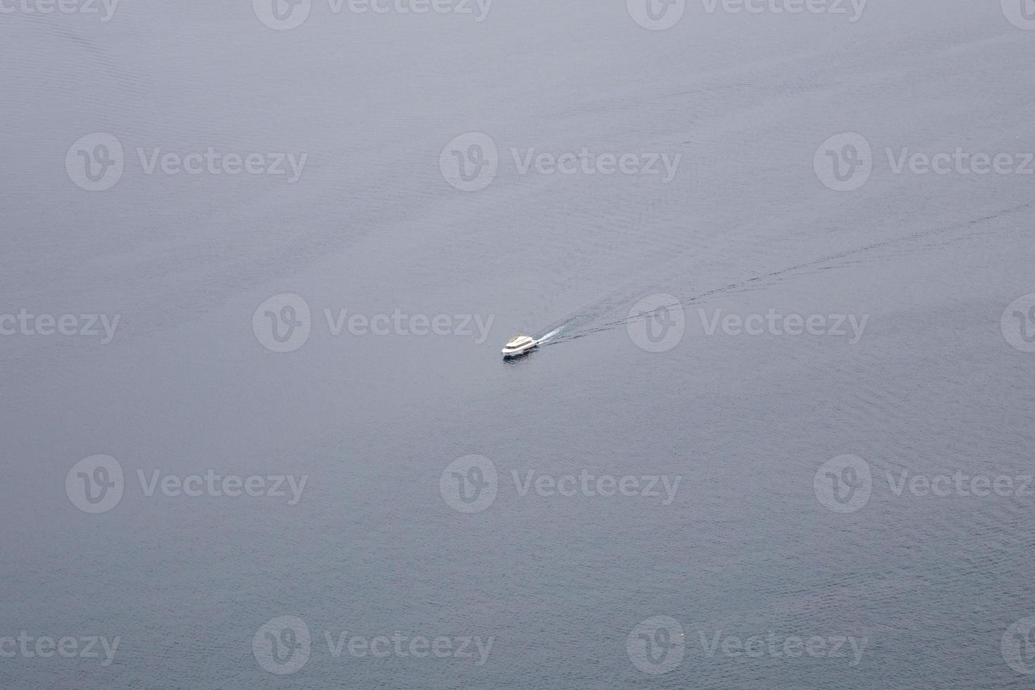Single boat on calm water surface photo