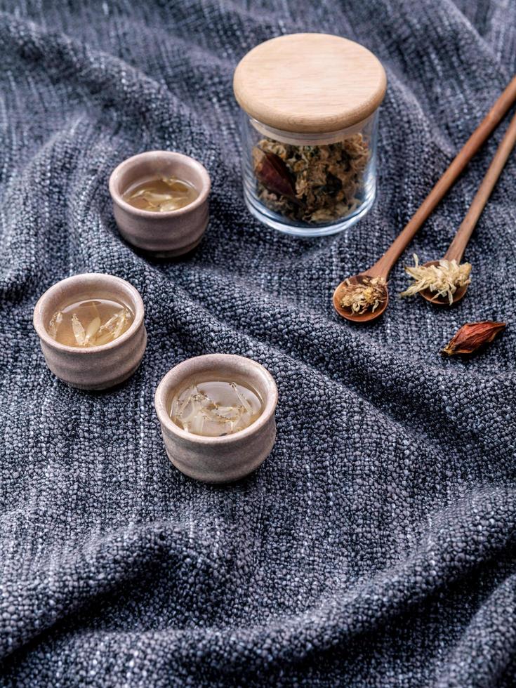 Chrysanthemum tea on cloth photo