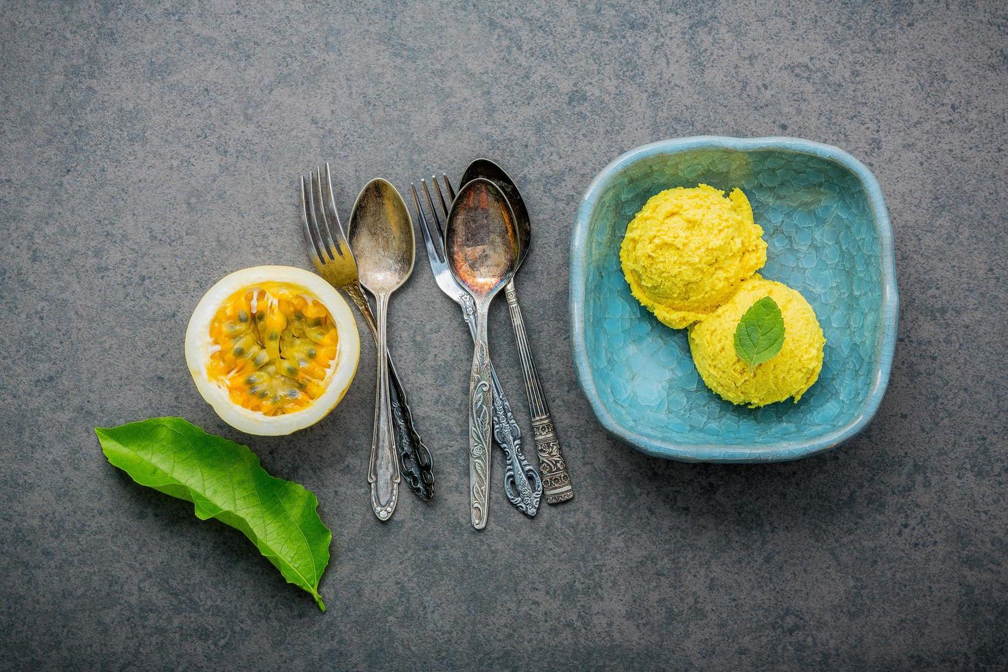 Passion fruit ice cream in a blue dish photo