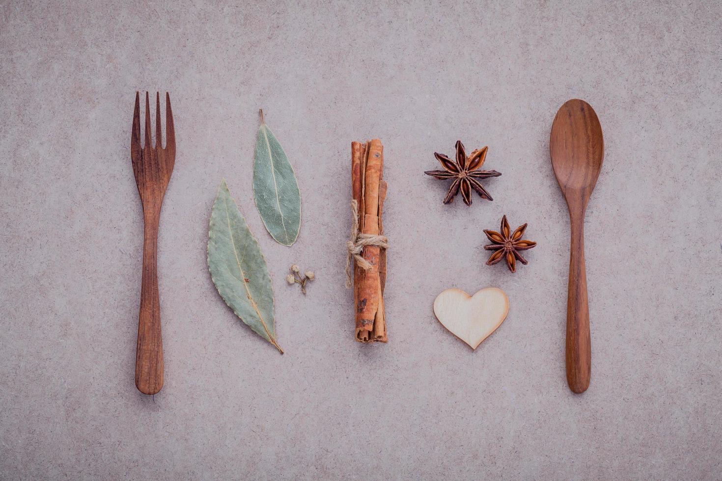 Wooden utensils with herbs and spices photo