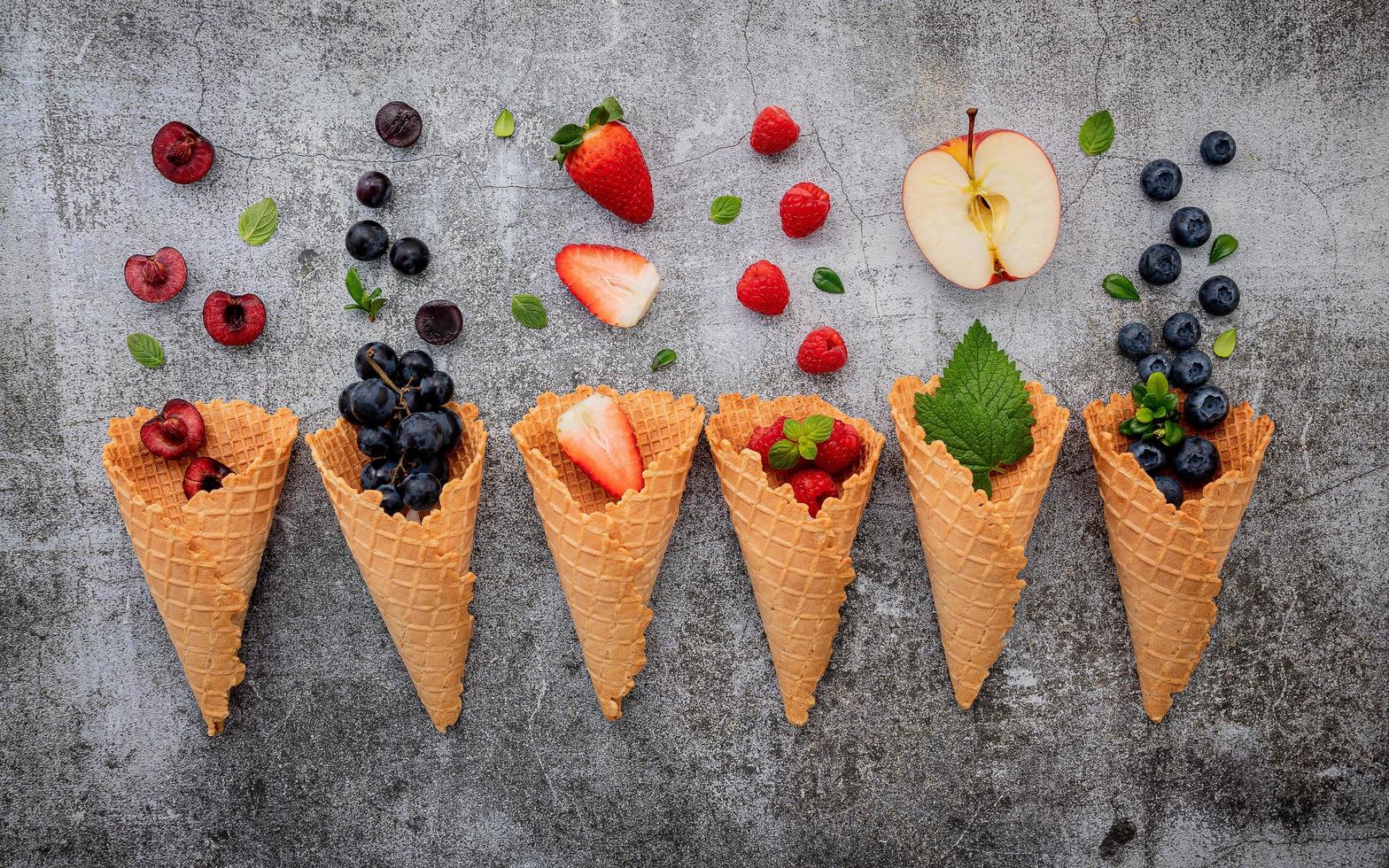 Flat lay of fruit and waffle cones photo