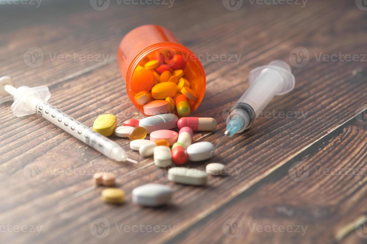Pills and syringes photo