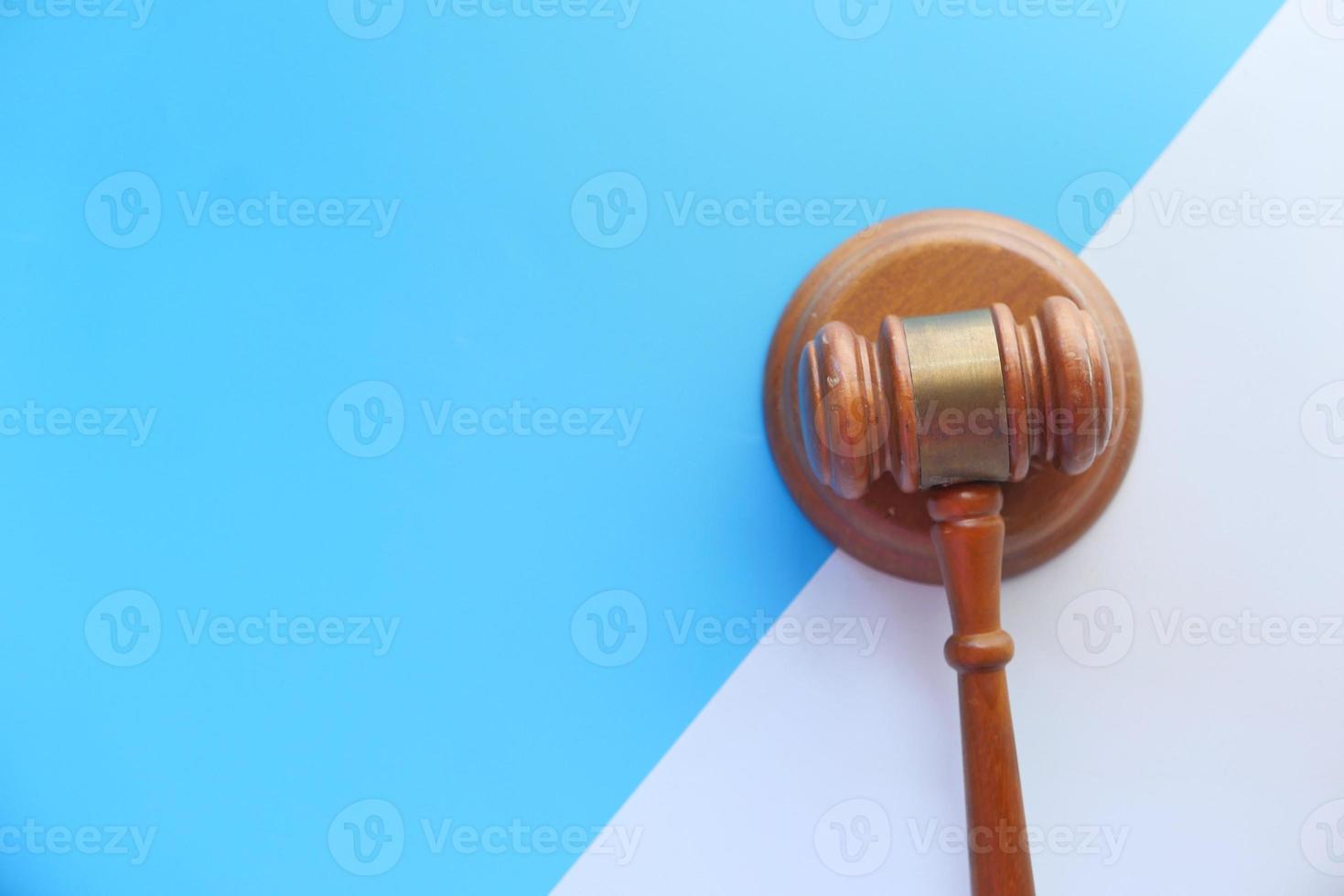 Top view of gavel on color background photo