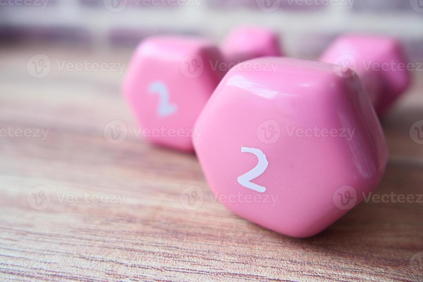 Pink dumbbells on a table photo