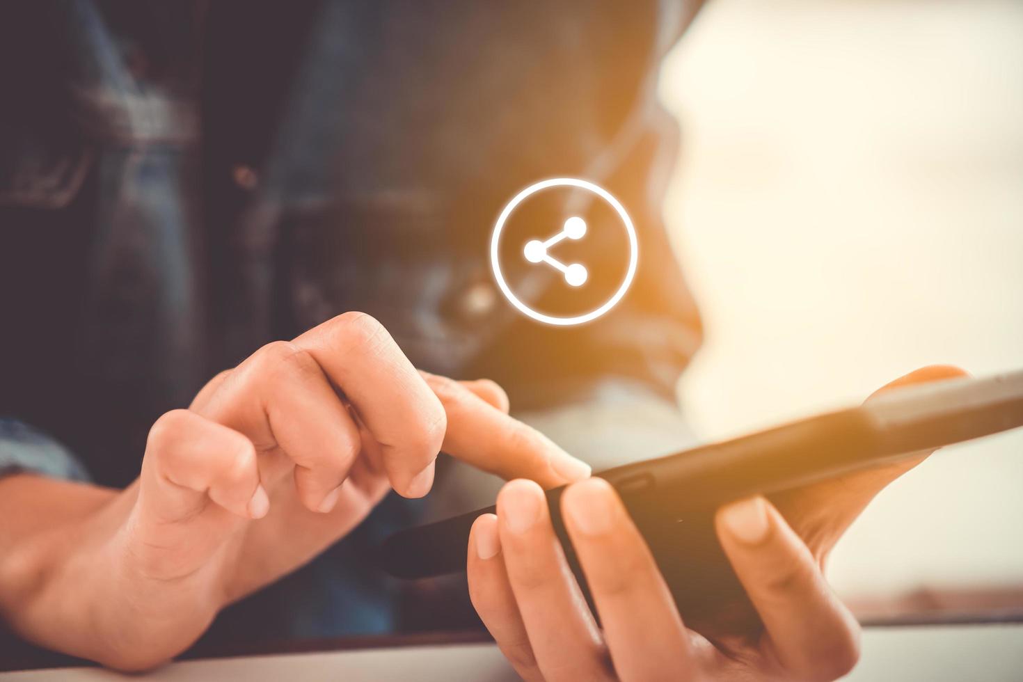 Woman using a smartphone with technology icons in the background photo