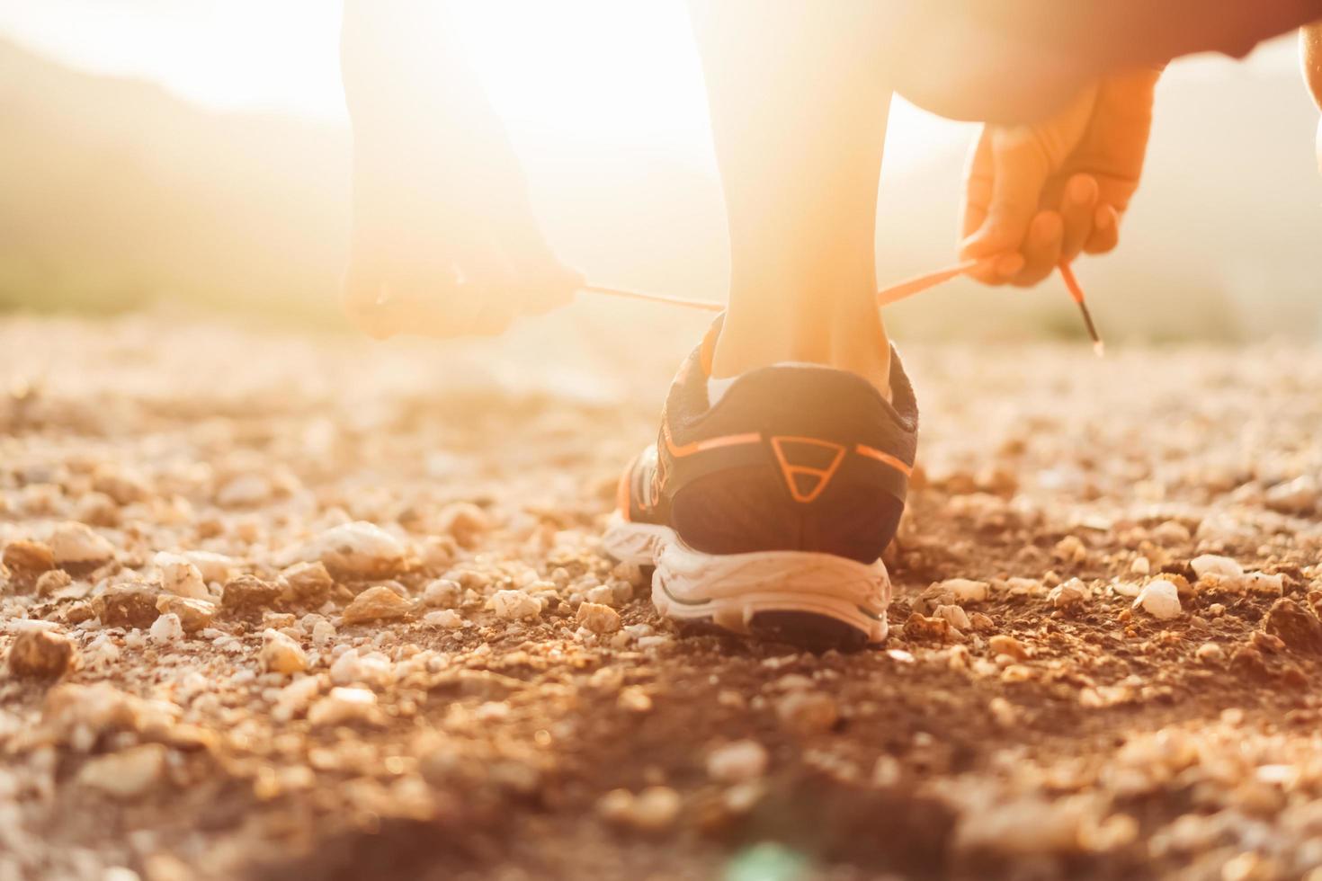 Woman wearing running shoe to run photo