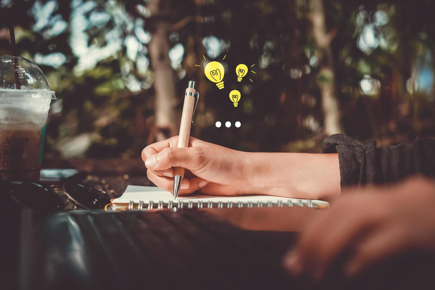 Woman using a smartphone with technology icons in the background photo