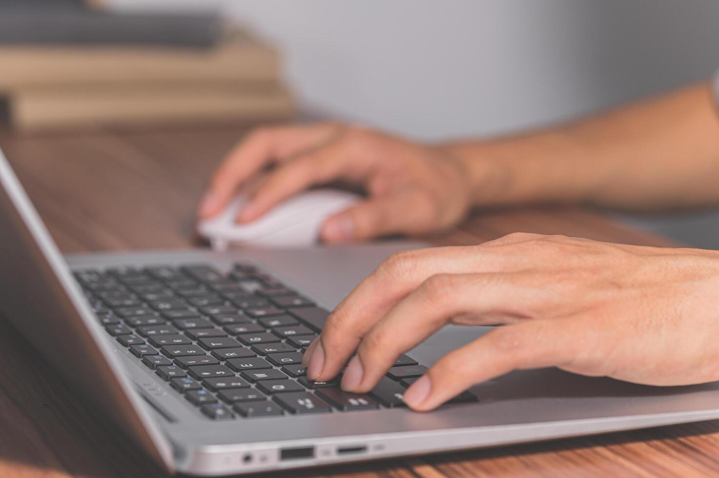 Human hands using computer to work and communicate photo