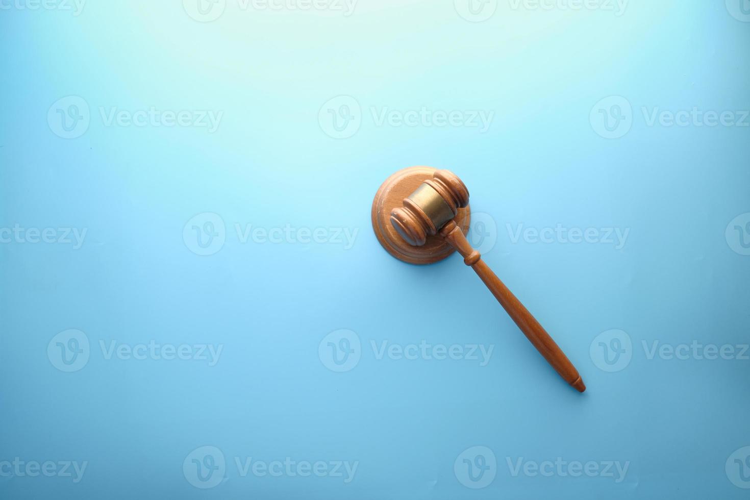 Top view of gavel on color background photo