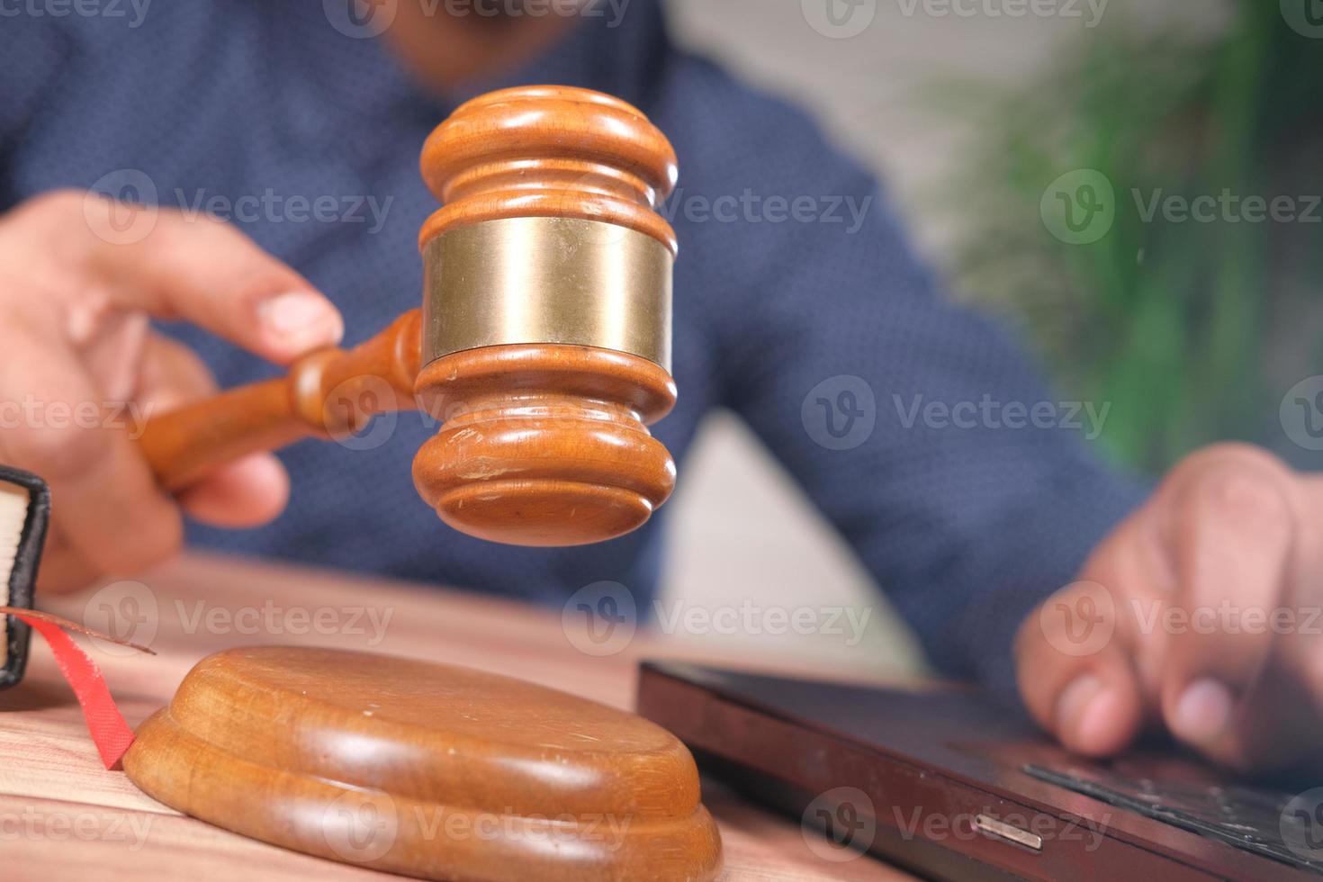 Man striking a gavel photo