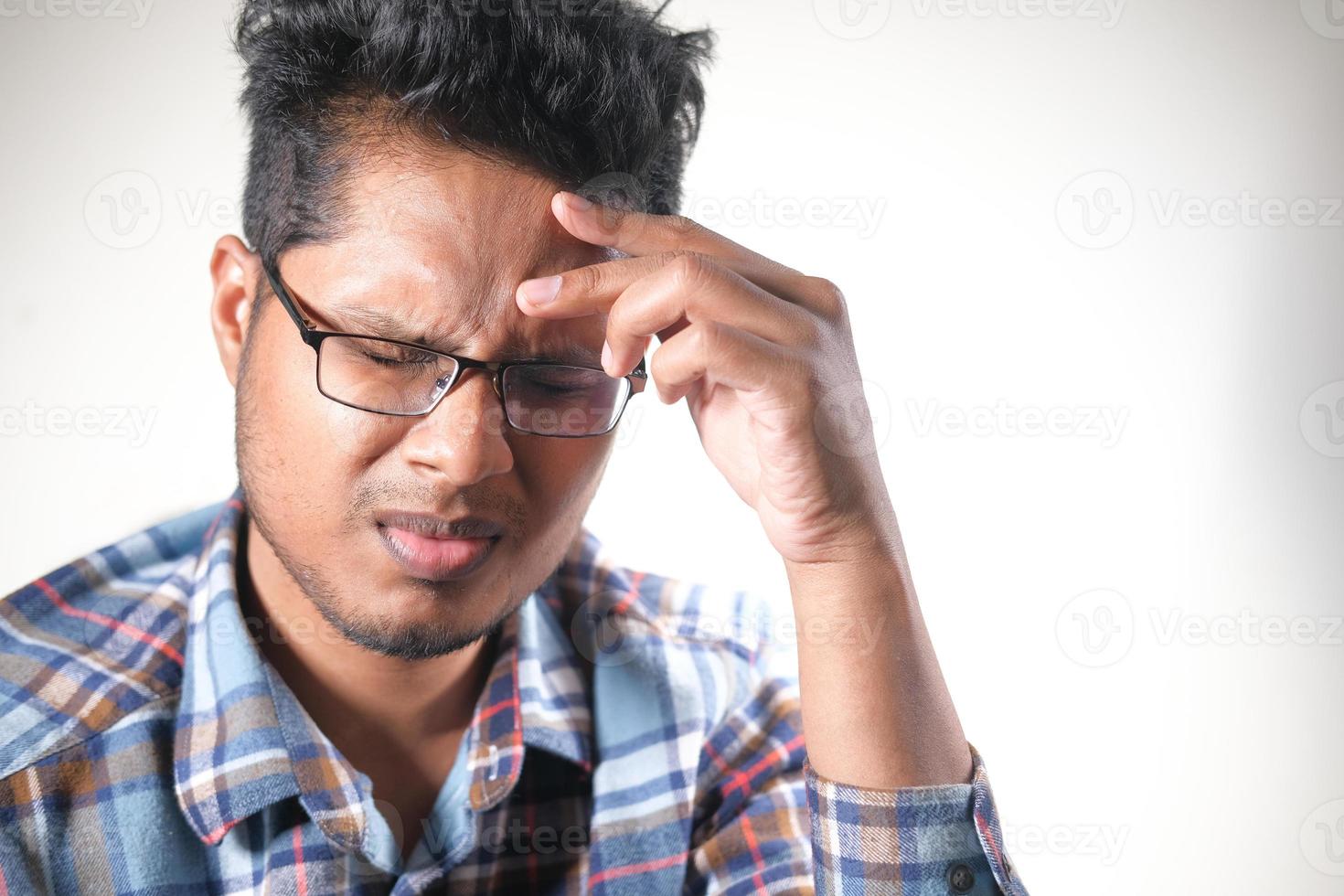 Young man with a headache photo