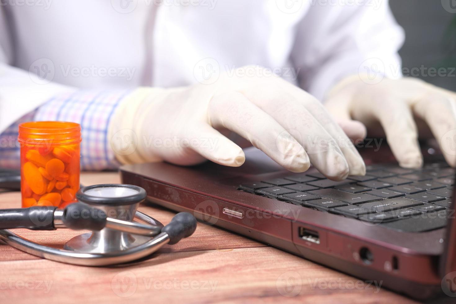 Man wearing gloves typing on keyboard 2073670 Stock Photo at Vecteezy
