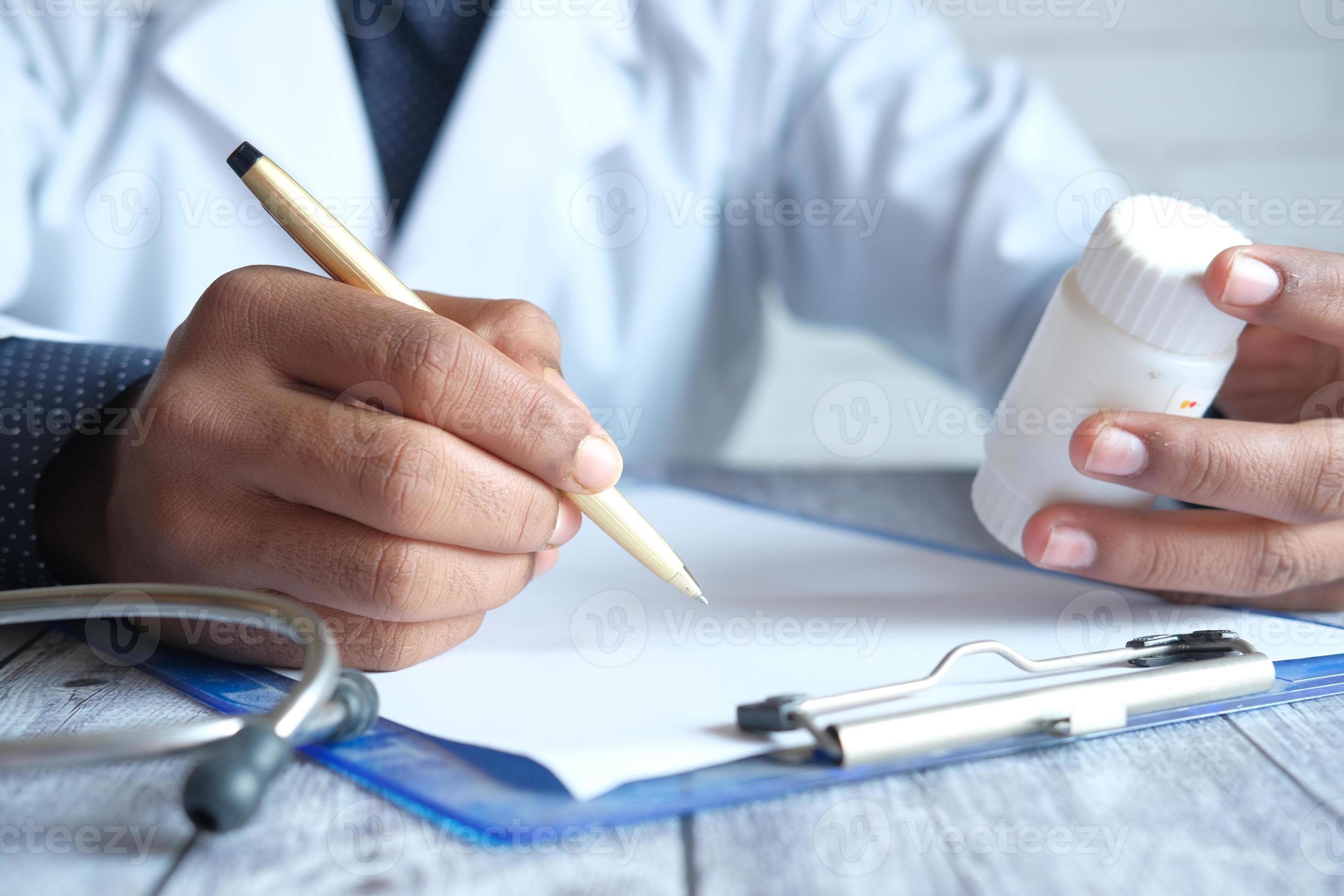 Doctor Writing A Prescription 2073732 Stock Photo At Vecteezy doctor-writing-a-prescription-2073732-stock-photo-at-vecteezy
