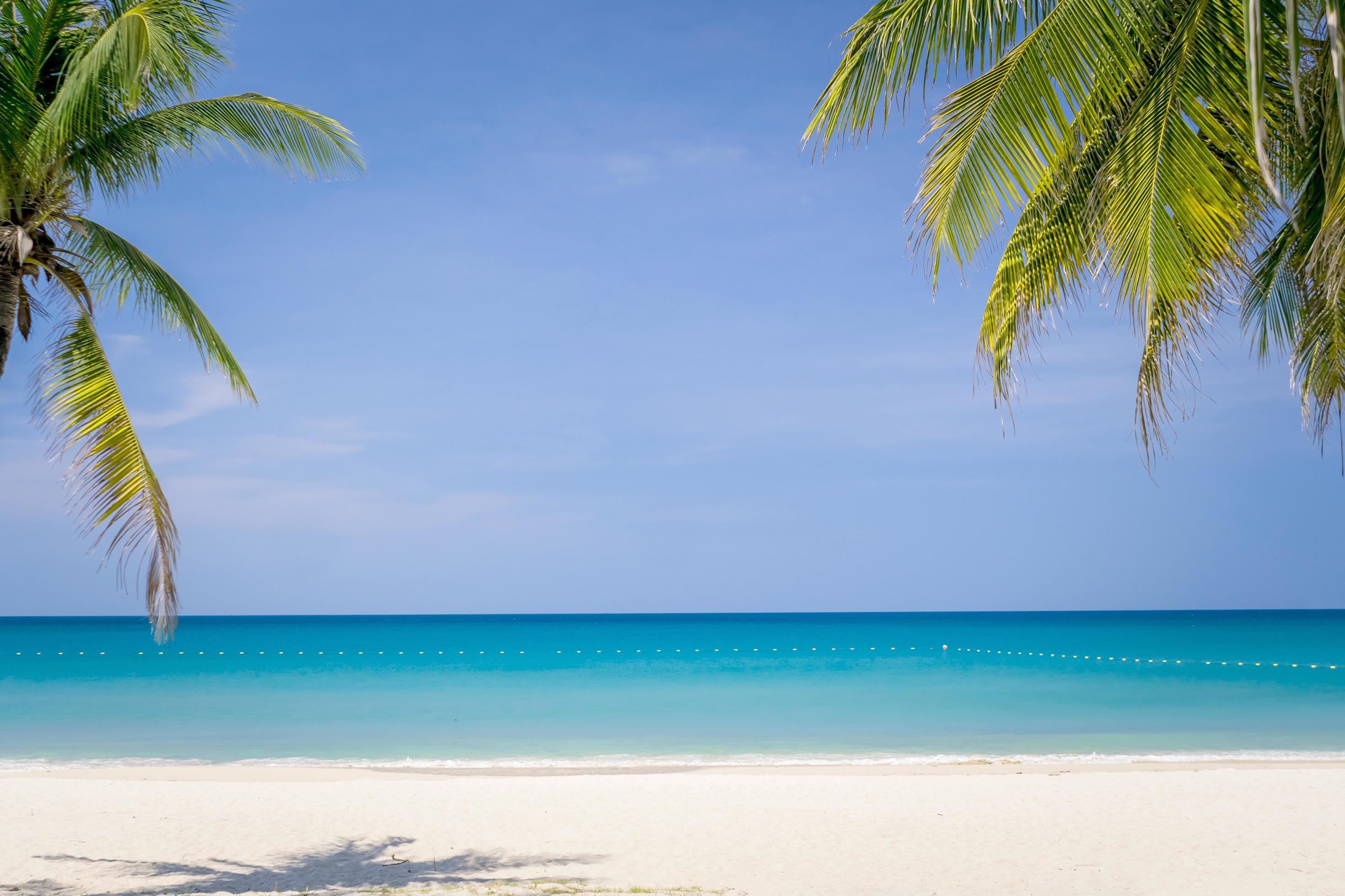 Tropical beach and blue sky background 2073795 Stock Photo at Vecteezy