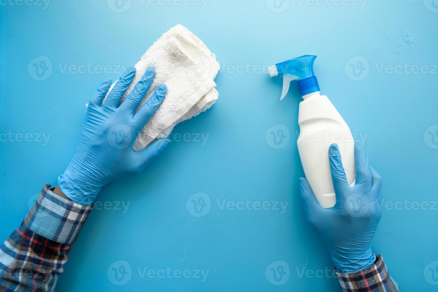 Disinfecting spray bottle and rag photo