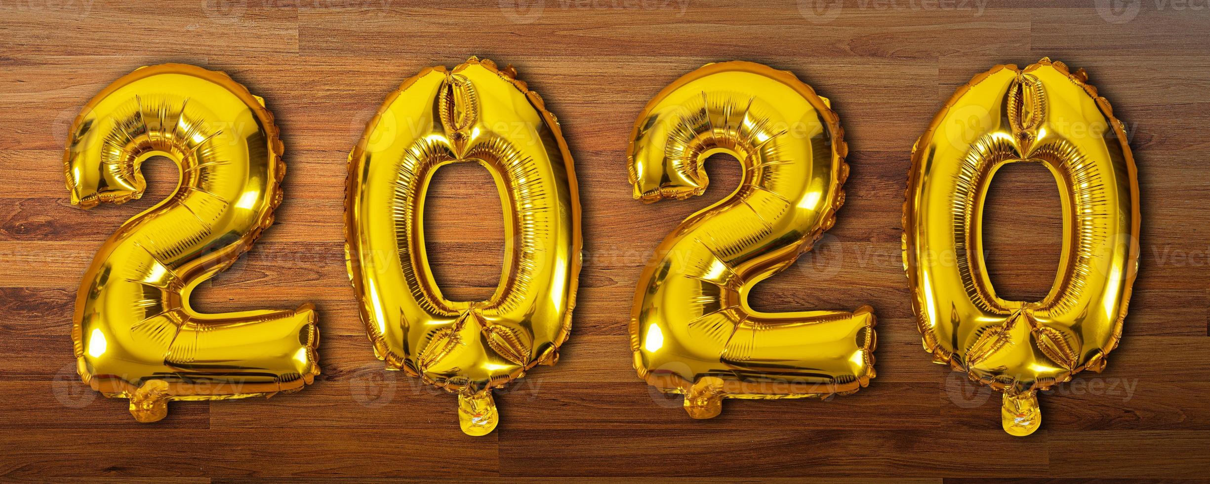 2020 number balloons on wooden background photo