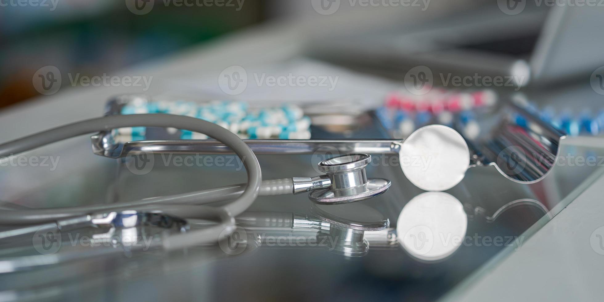 Stethoscope and medicine close-up photo