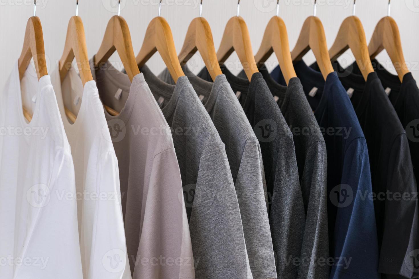 Close up of t-shirts on hangers, apparel background photo