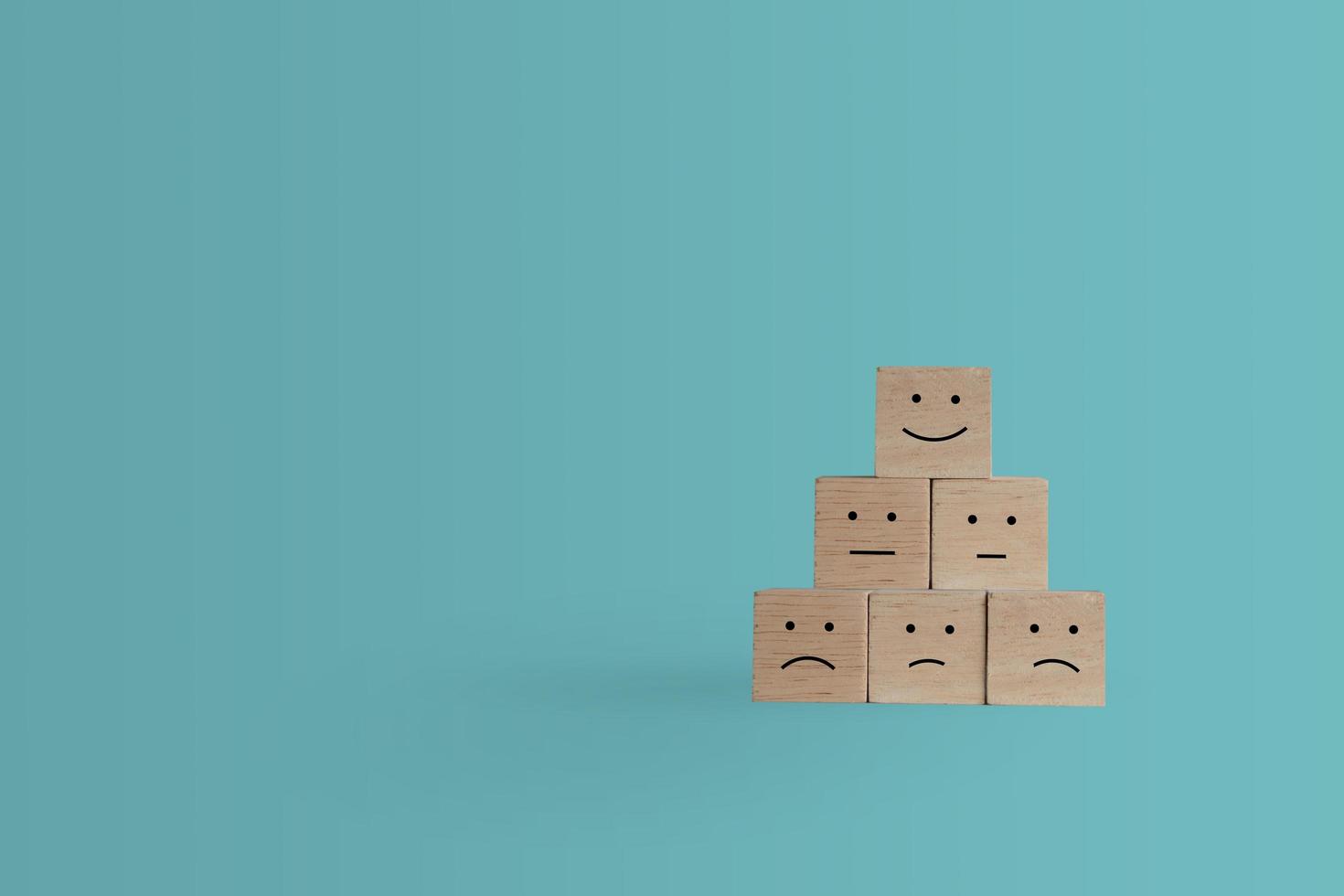 Smiley face icon on wood cubes photo