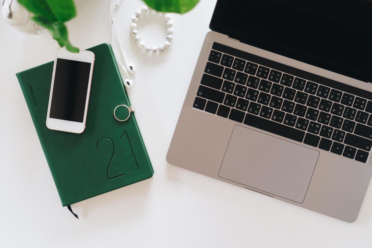Top view of modern laptop or notebook with phone to work photo