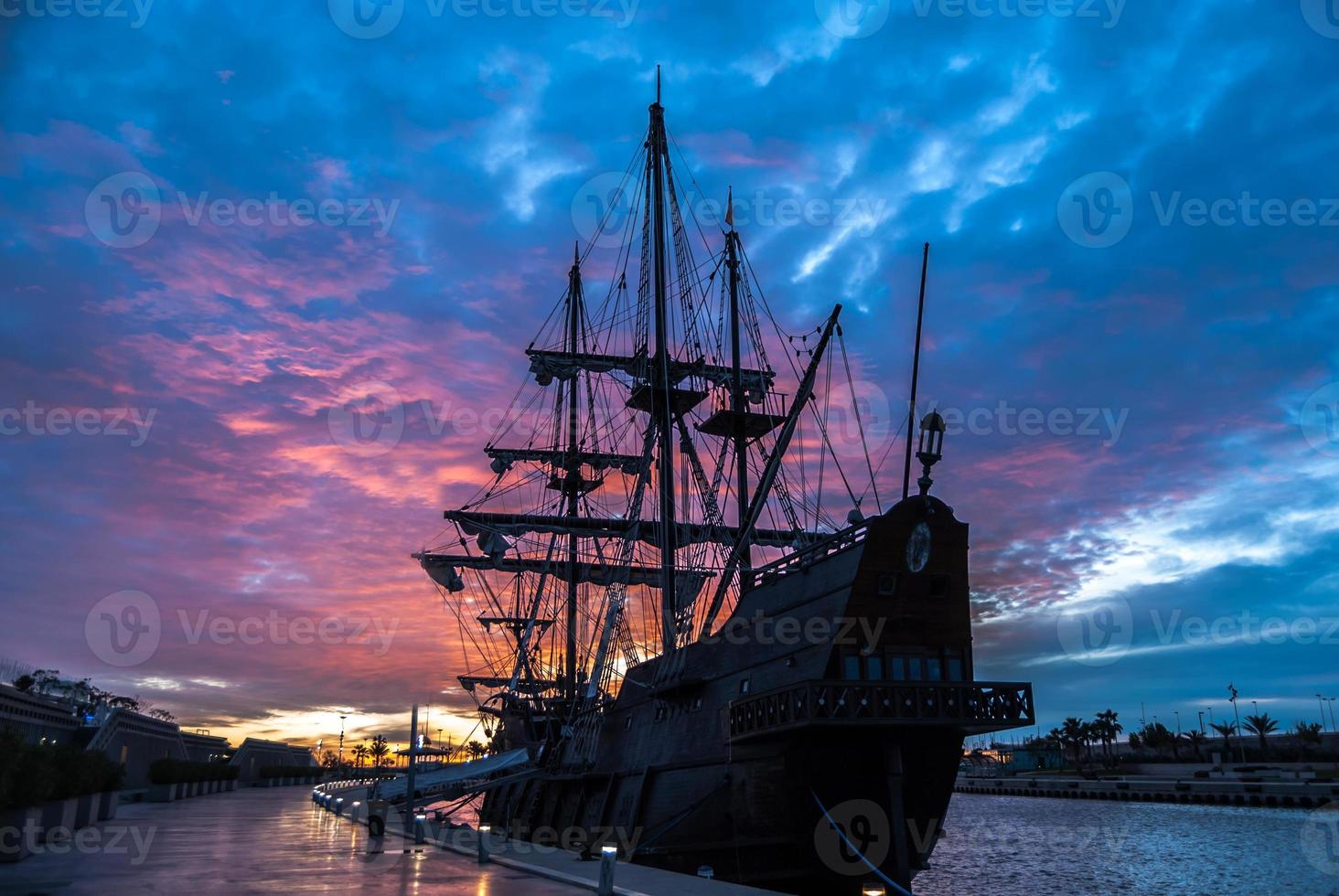 Galleon ship in the port photo