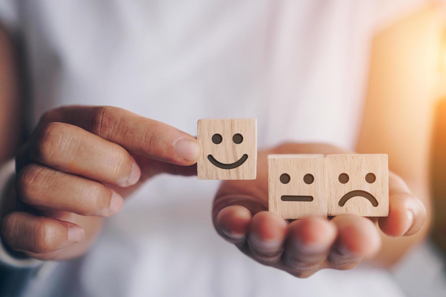 Smiley face and cart icon on wood cubes photo