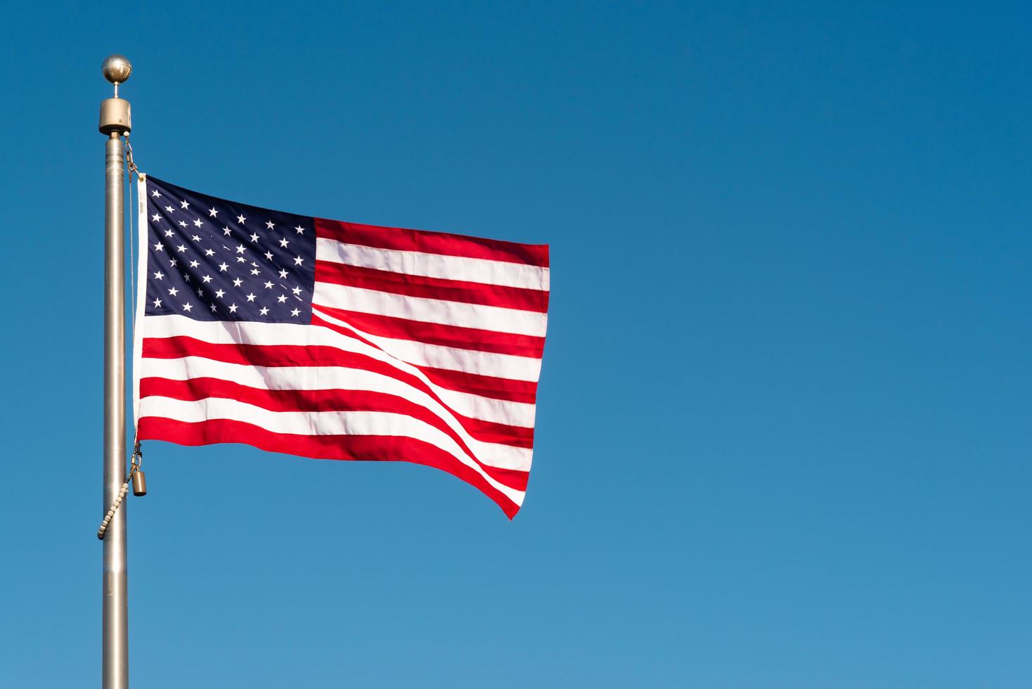 American flag blowing in the wind photo