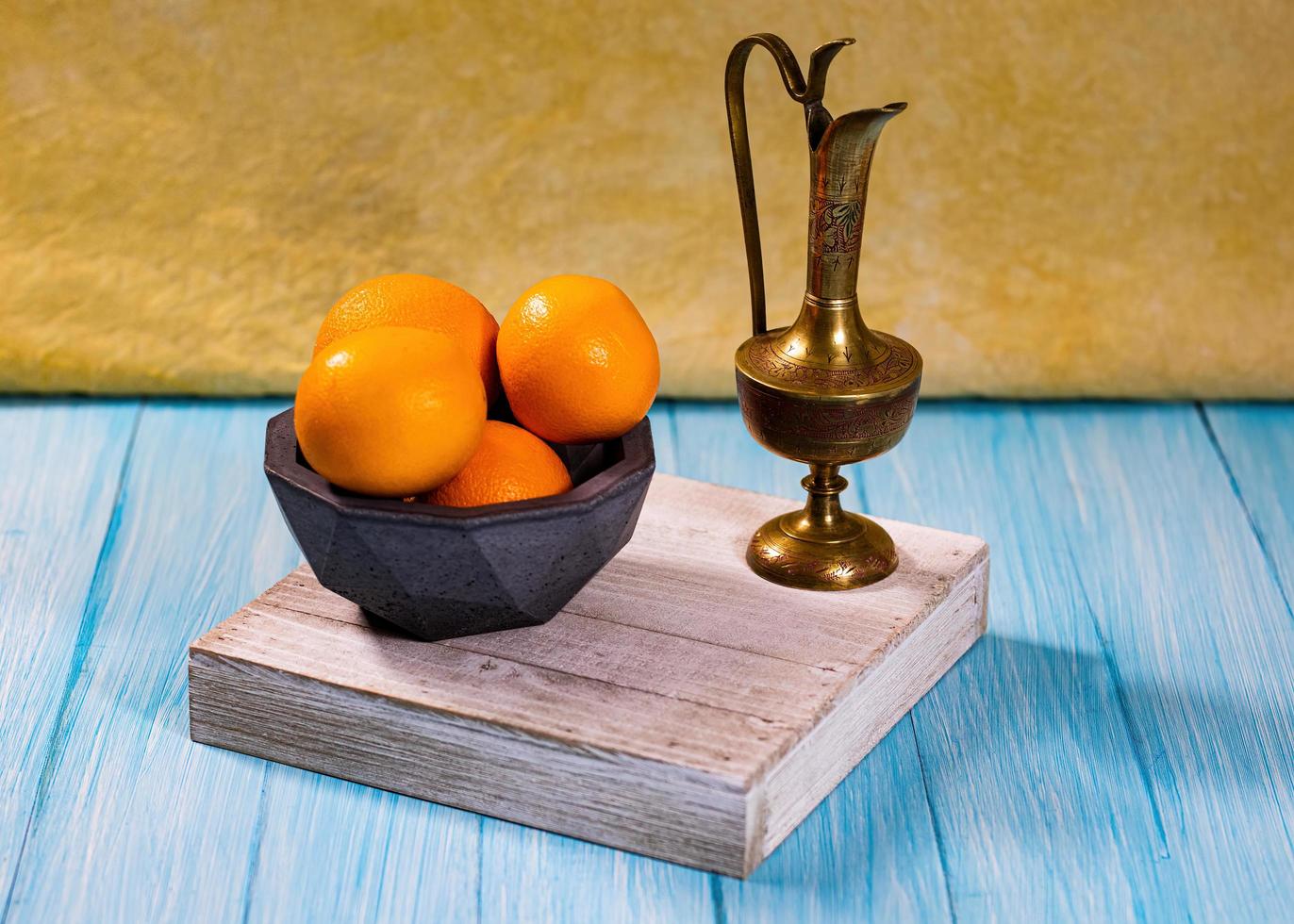Brass pitcher and bowl of pranges photo