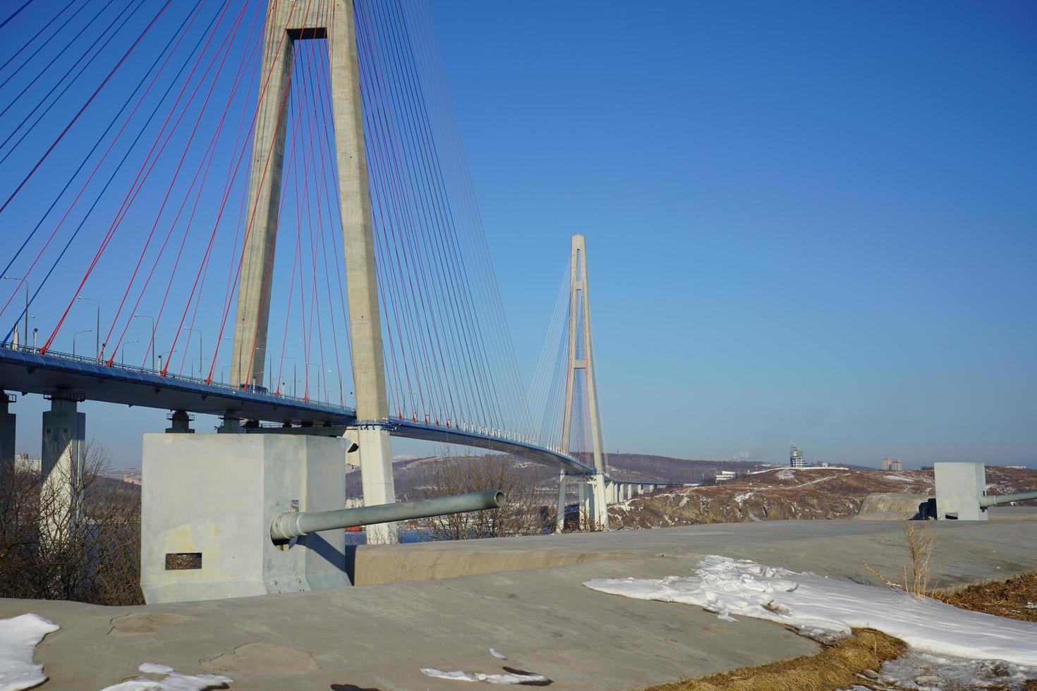 Russky Bridge against a clear blue sky in Vladivostok, Russia photo