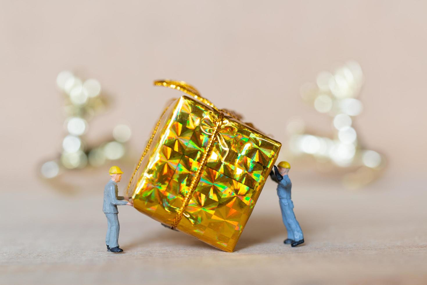 Miniature workers working on Christmas decorations, Christmas and Happy New Year concept photo