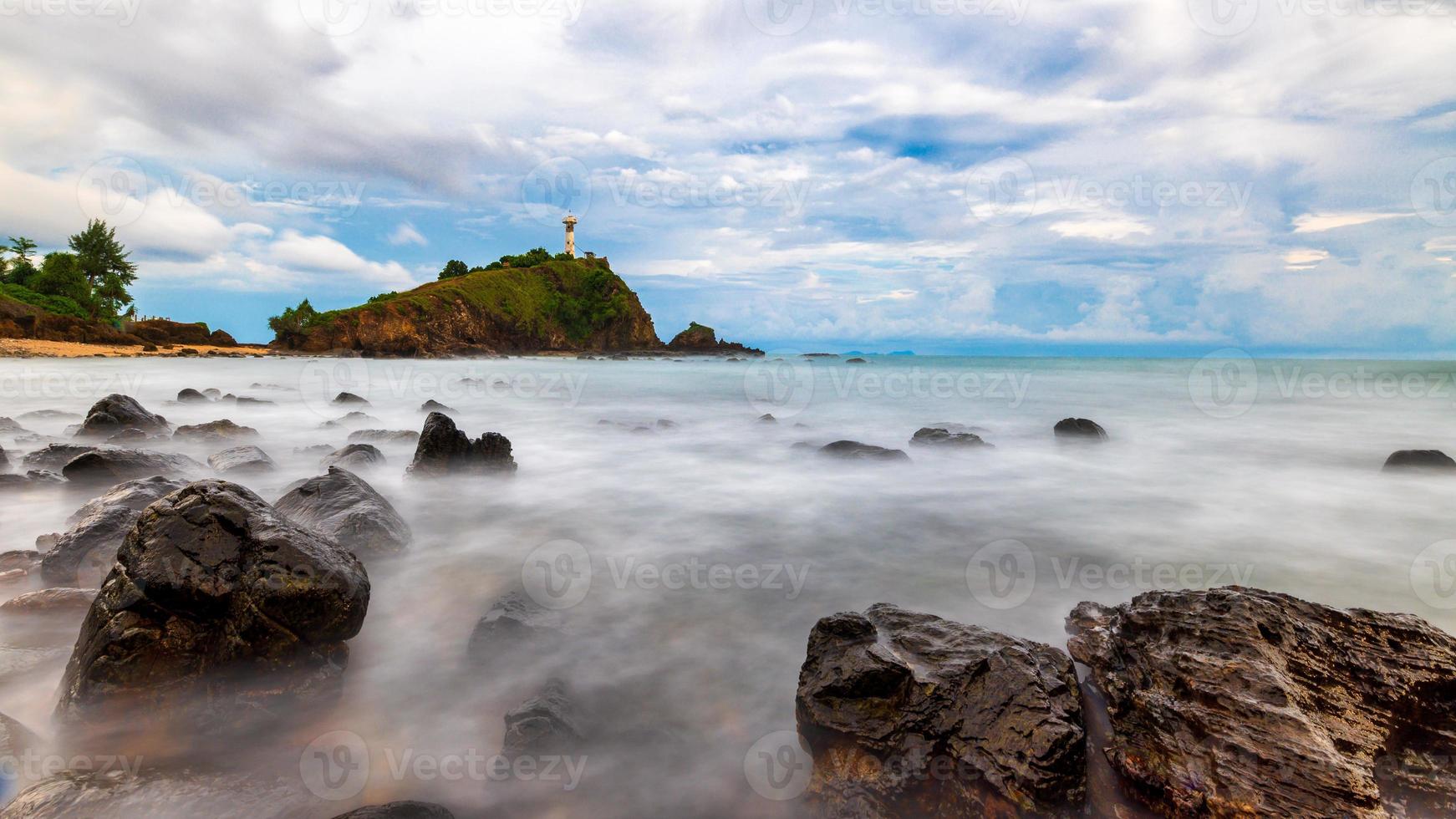 Lighthouse with rock in Thailand photo