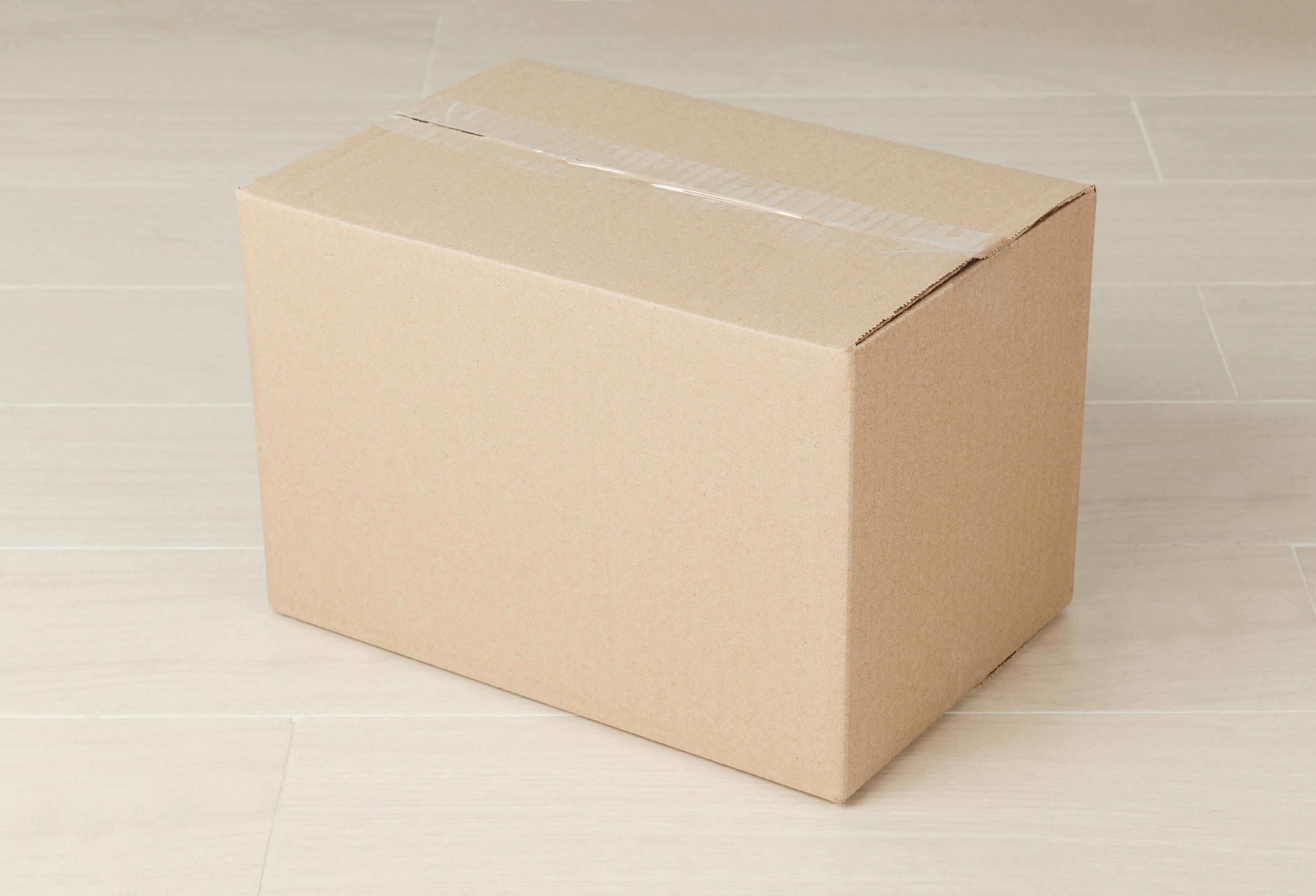 Cardboard box on floor 2078318 Stock Photo at Vecteezy