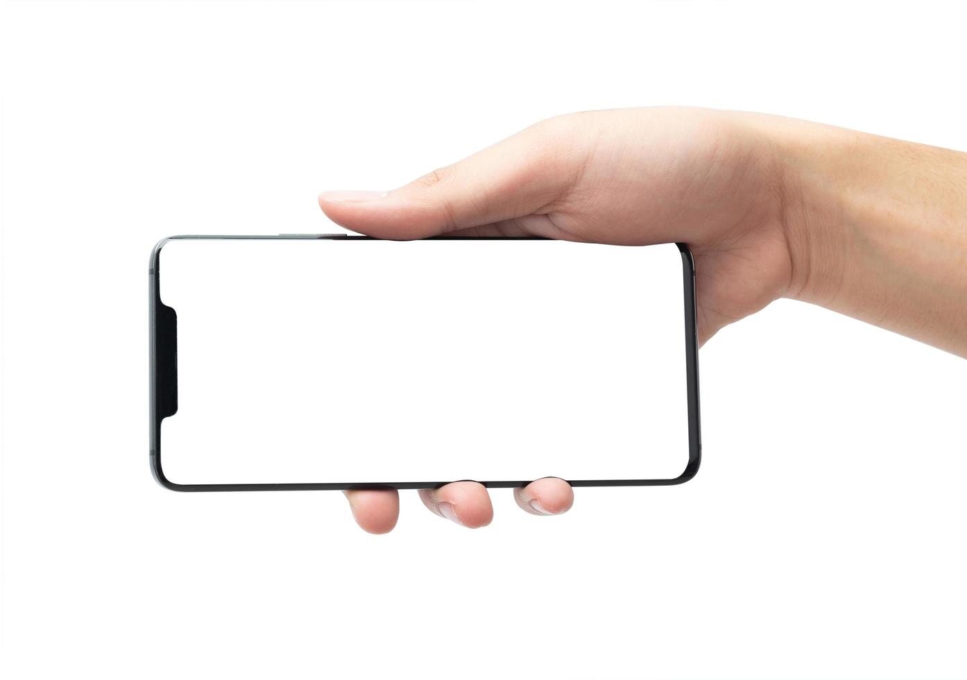 Hand holding horizontal phone mock-up photo