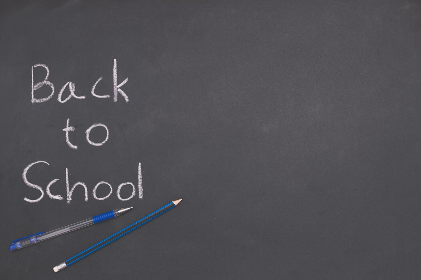 Back to school and education concept on blackboard photo