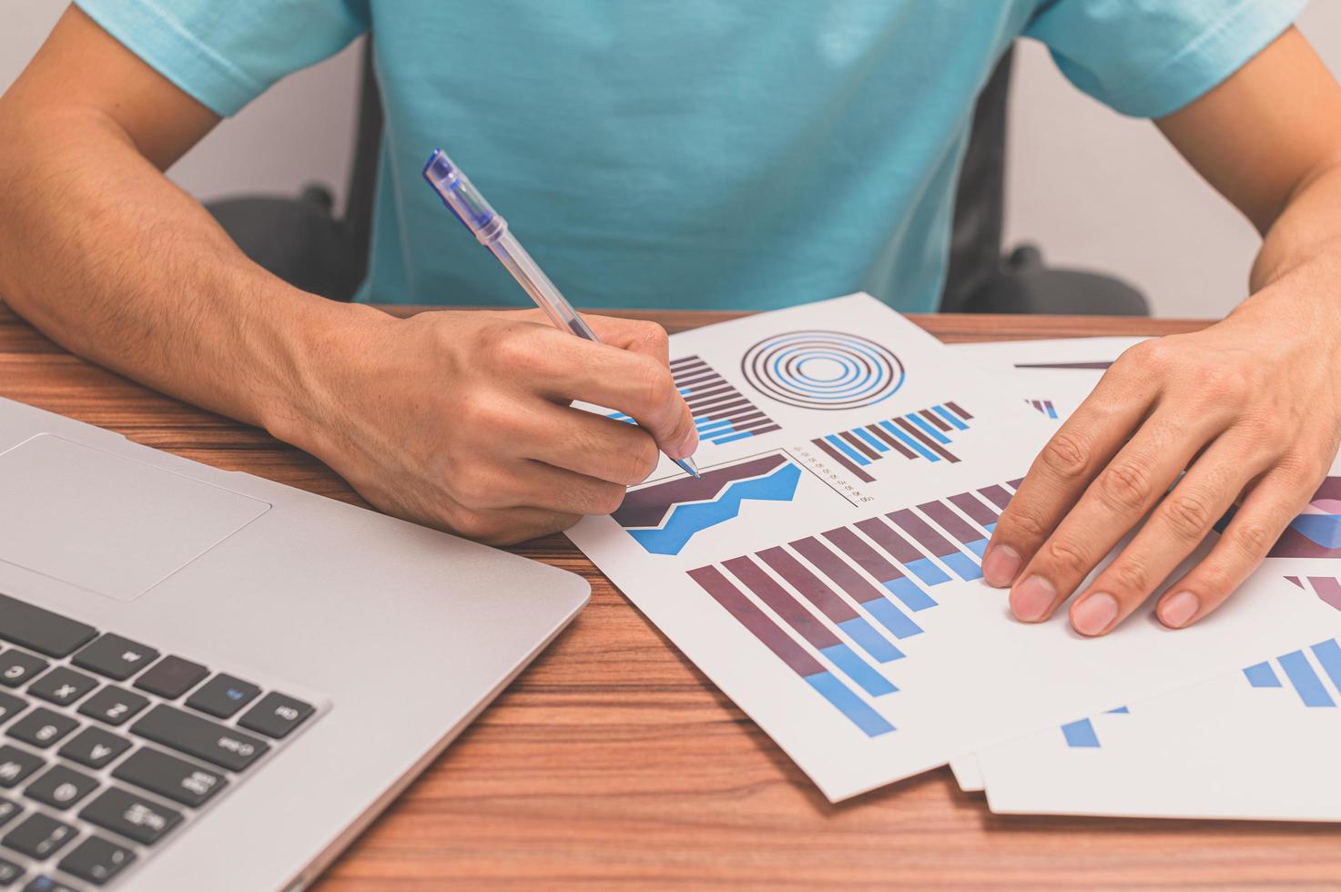 Man taking view of business growth graphs photo