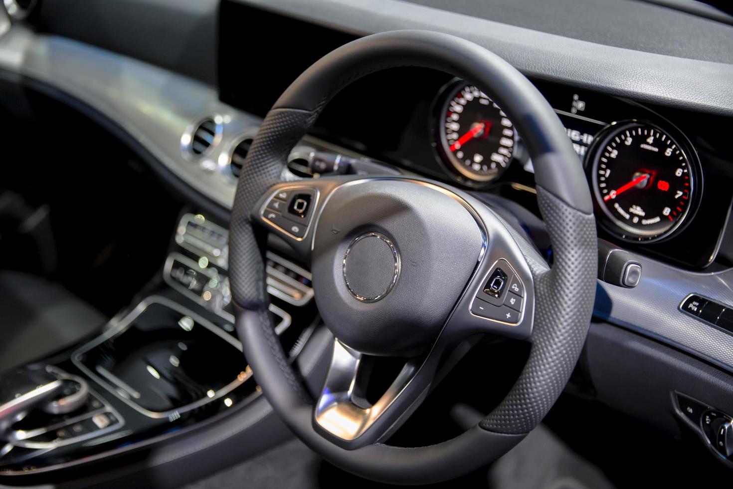 Clean console modern car interior black steering wheel photo