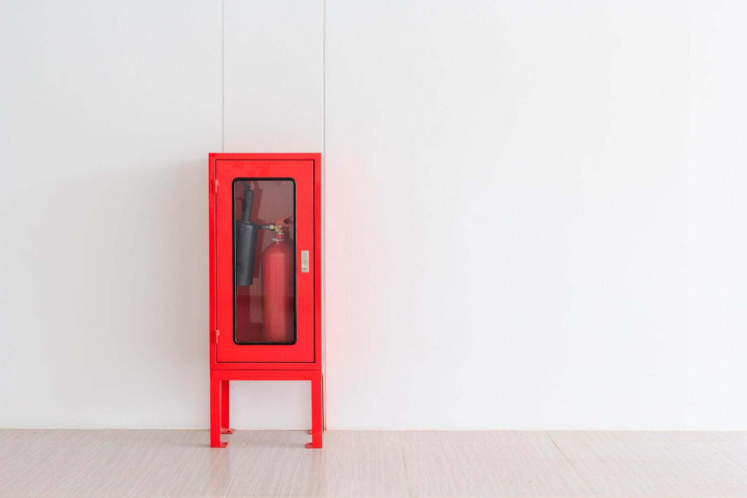 Fire Extinguisher in red Cabinet photo