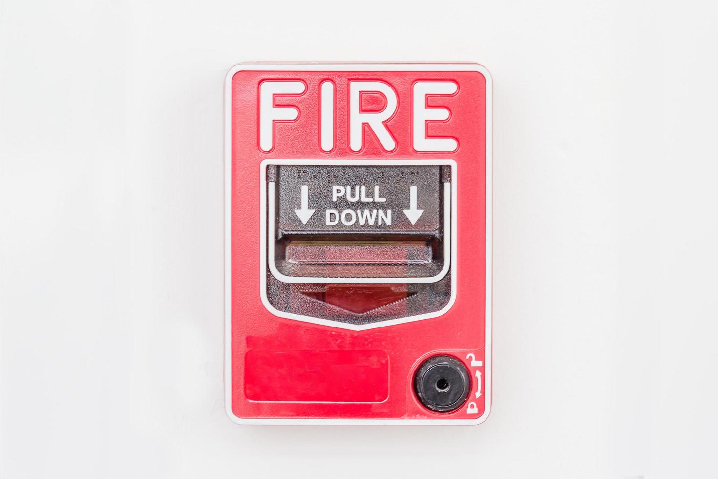 Fire alarm switch on white wall photo