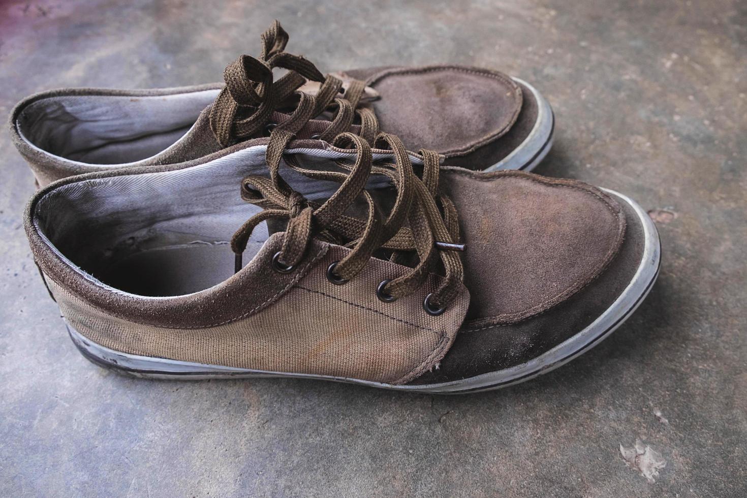 Pair of canvas shoes on a floor photo