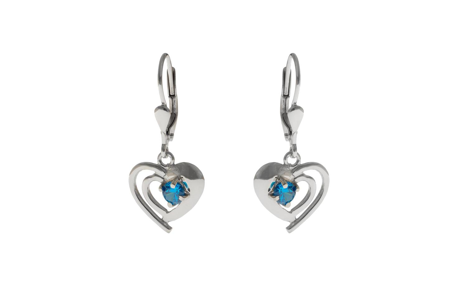 Silver earrings in the shape of heart photo